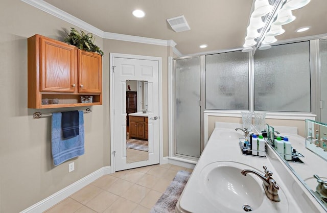 bathroom with a sink, ornamental molding, visible vents, an inviting chandelier, and a shower stall