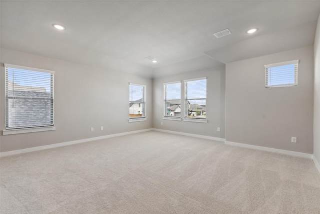unfurnished room featuring light carpet, baseboards, visible vents, and recessed lighting