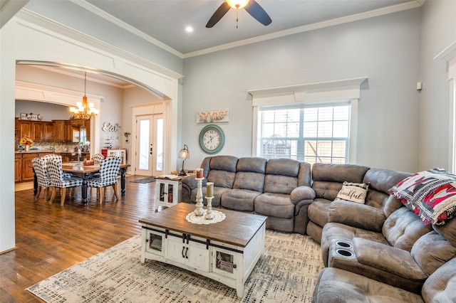1932 Fm 36 S, Caddo Mills, TX 75135 - living area with a wealth of natural light, wood finished floors, ceiling fan with notable chandelier, and arched walkways