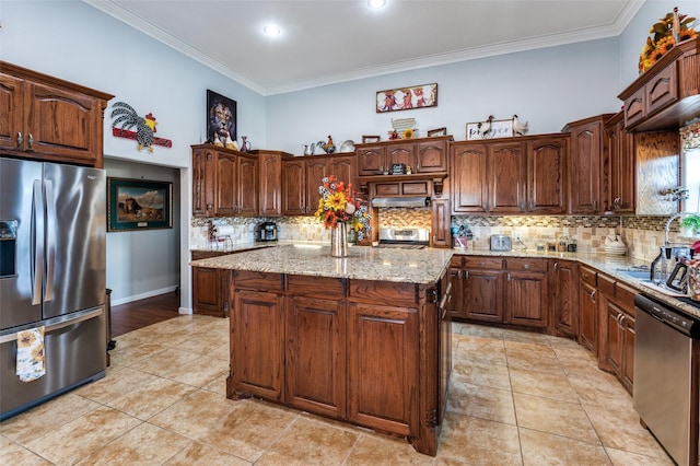 1932 Fm 36 S, Caddo Mills, TX 75135 - kitchen featuring light stone countertops, ornamental molding, a kitchen island, backsplash, and appliances with stainless steel finishes