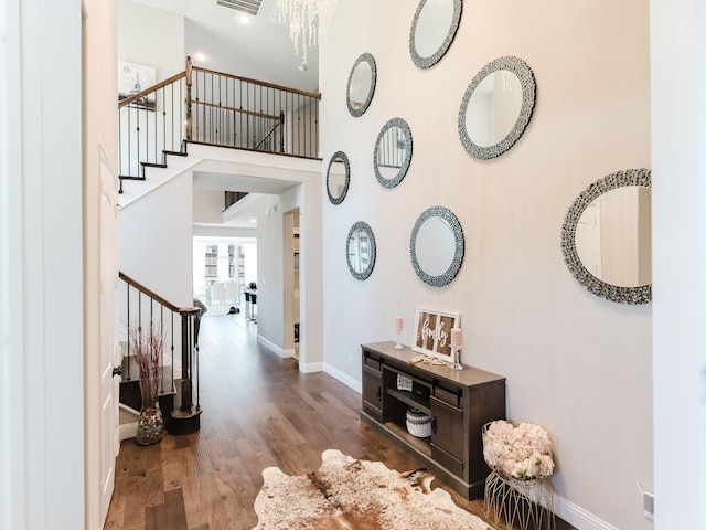 5932 Folsum Pl, Mckinney, TX 75070 - foyer featuring an inviting chandelier, stairs, baseboards, and wood finished floors