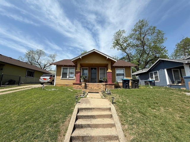 bungalow-style house with a front lawn