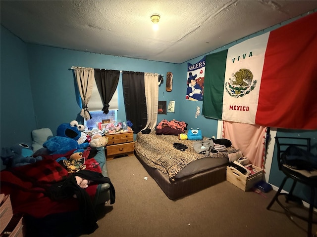 bedroom featuring a textured ceiling and carpet floors