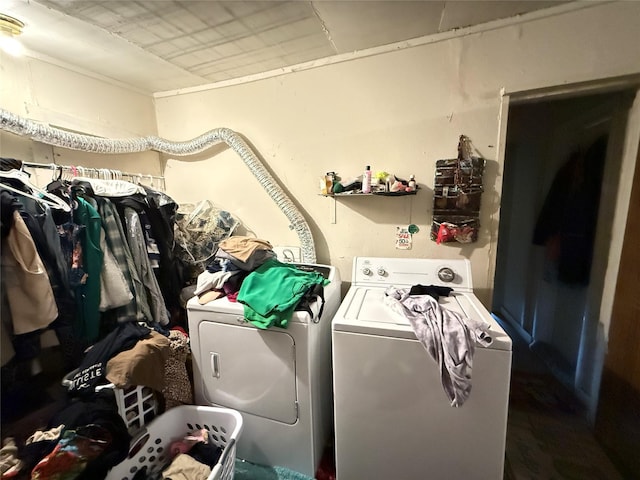 laundry room with separate washer and dryer and laundry area