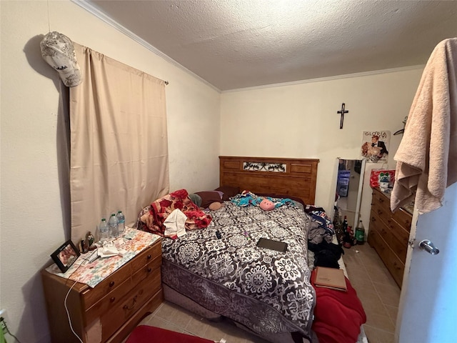 tiled bedroom with crown molding and a textured ceiling