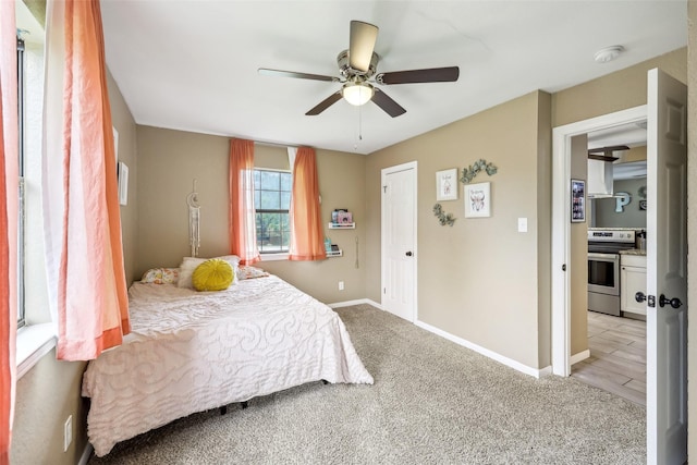 1015 Van Winkle St, Weatherford, TX 76086 - bedroom with light carpet, baseboards, and a ceiling fan