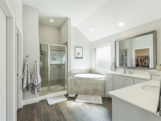 1455 Radecke Rd, Krum, TX 76249 - bathroom with a stall shower, vanity, a garden tub, a walk in closet, and vaulted ceiling