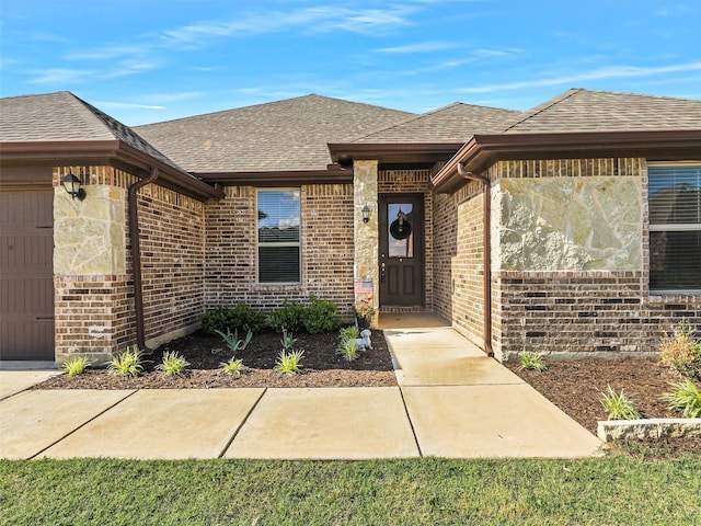 1455 Radecke Rd, Krum, TX 76249 - property entrance featuring roof with shingles, brick siding, and an attached garage