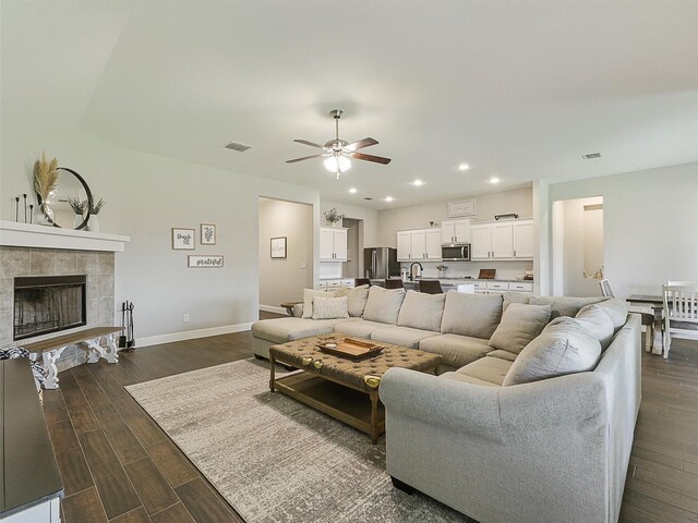 1455 Radecke Rd, Krum, TX 76249 - living area with ceiling fan, dark wood-style floors, baseboards, a fireplace, and recessed lighting