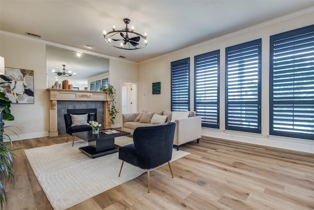 1305 Burgundy Ct, Southlake, TX 76092 - living room featuring a chandelier, wood finished floors, ornamental molding, baseboards, and a tile fireplace