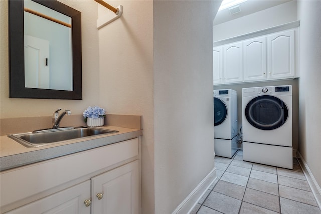 1305 Burgundy Ct, Southlake, TX 76092 - washroom with washer and dryer, baseboards, cabinet space, and light tile patterned floors