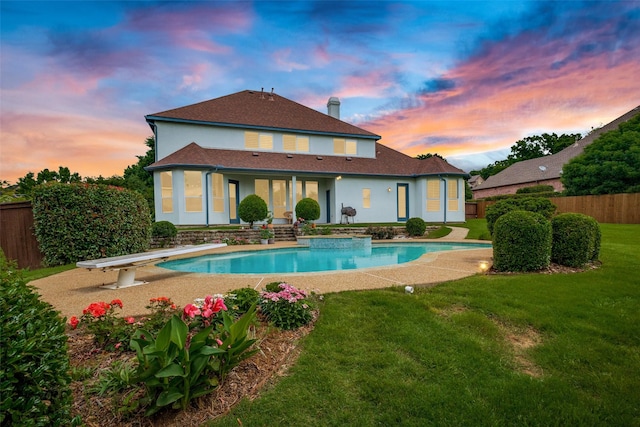 1305 Burgundy Ct, Southlake, TX 76092 - back of property at dusk featuring stucco siding and a shingled roof