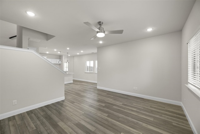 216 Griffith, Princeton, TX 75407 - unfurnished living room with ceiling fan, wood finished floors, baseboards, stairs, and recessed lighting