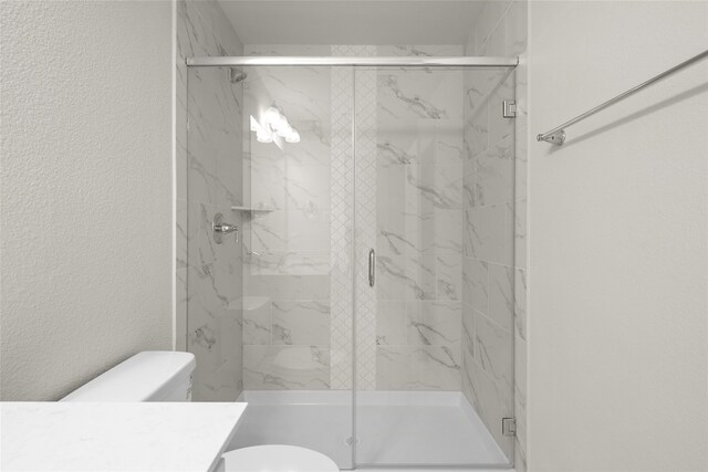 216 Griffith, Princeton, TX 75407 - full bath with vanity, toilet, a marble finish shower, and a textured wall
