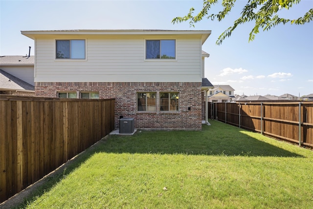 216 Griffith, Princeton, TX 75407 - rear view of house with brick siding and cooling unit