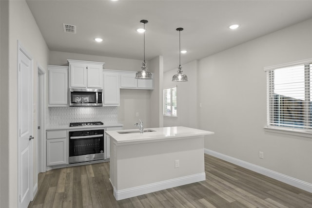 216 Griffith, Princeton, TX 75407 - kitchen featuring wall oven, stainless steel microwave, a sink, wood finished floors, and gas cooktop