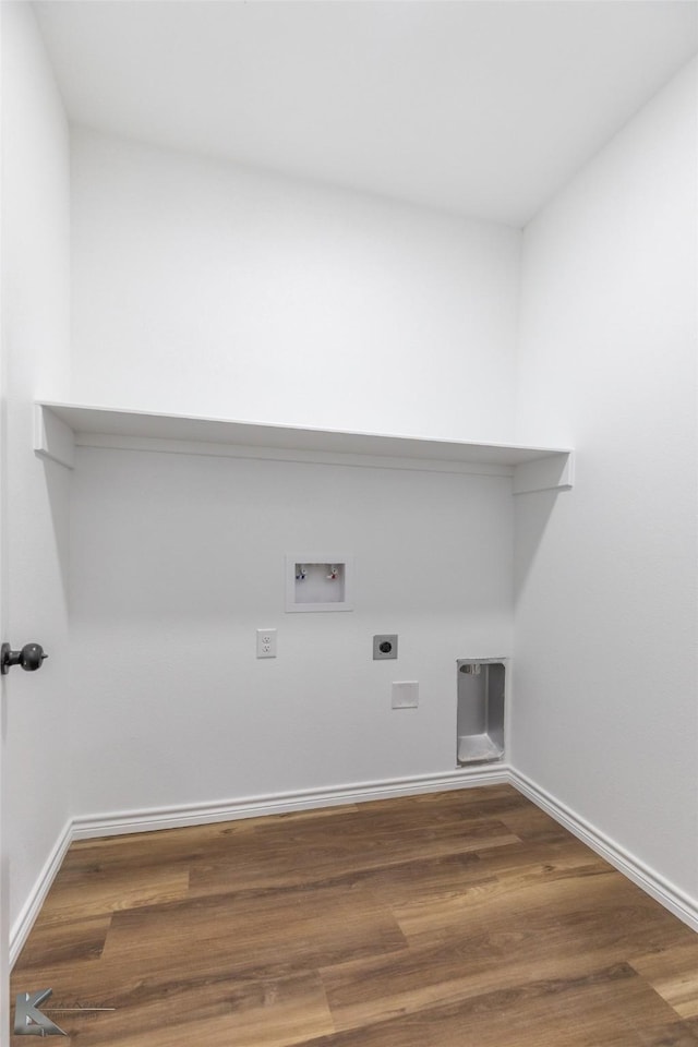 washroom featuring wood finished floors, laundry area, hookup for an electric dryer, baseboards, and hookup for a washing machine