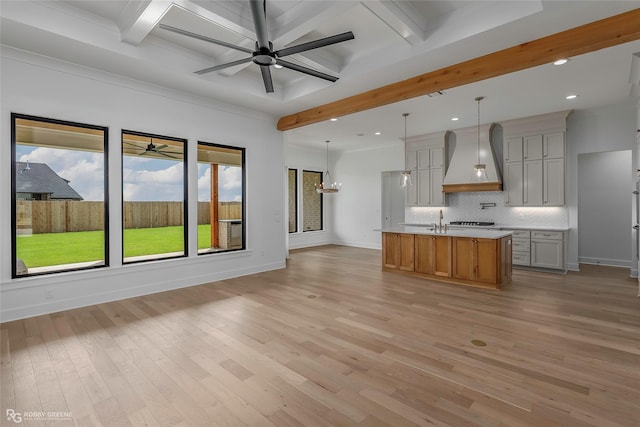 kitchen with beam ceiling, ceiling fan, tasteful backsplash, custom exhaust hood, and recessed lighting