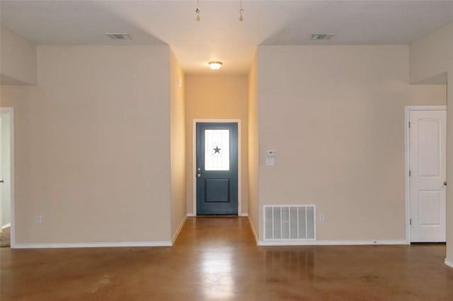 entryway with baseboards and visible vents