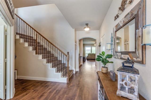3530 Beaumont Dr, Wylie, TX 75098 - foyer featuring arched walkways, wood finished floors, baseboards, and stairway