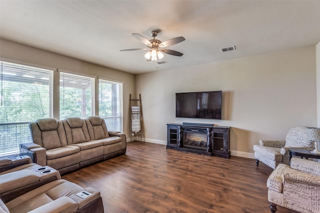 3530 Beaumont Dr, Wylie, TX 75098 - living area featuring ceiling fan, baseboards, wood finished floors, and a glass covered fireplace