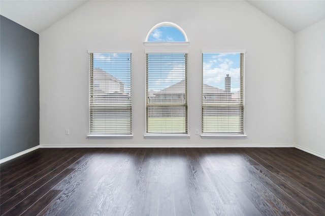 1112 Crest Ridge Dr, Glenn Heights, TX 75154 - empty room featuring vaulted ceiling, healthy amount of natural light, wood finished floors, and baseboards