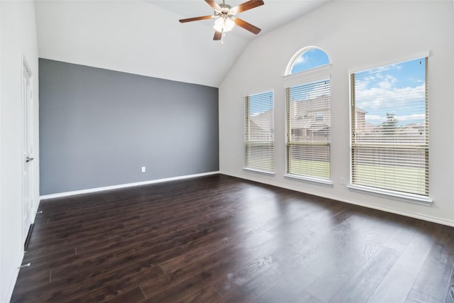 1112 Crest Ridge Dr, Glenn Heights, TX 75154 - unfurnished room with lofted ceiling, dark wood-style flooring, a ceiling fan, and baseboards