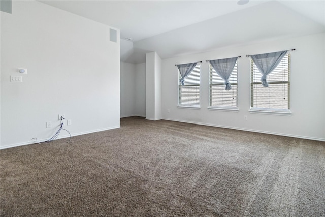 1112 Crest Ridge Dr, Glenn Heights, TX 75154 - empty room featuring vaulted ceiling, carpet, and baseboards