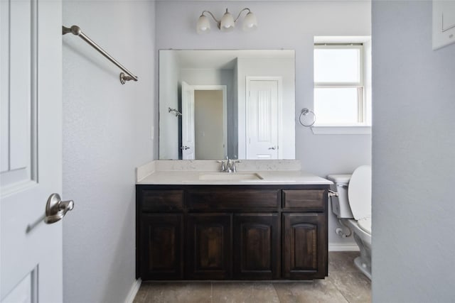 1112 Crest Ridge Dr, Glenn Heights, TX 75154 - bathroom with vanity, toilet, and baseboards