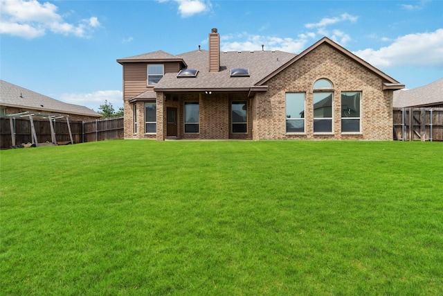 1112 Crest Ridge Dr, Glenn Heights, TX 75154 - rear view of house featuring a chimney, brick siding, and a shingled roof