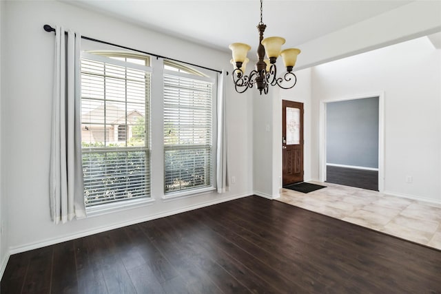 1112 Crest Ridge Dr, Glenn Heights, TX 75154 - unfurnished dining area featuring a chandelier, dark wood finished floors, and baseboards
