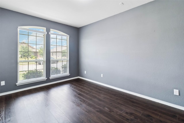 1112 Crest Ridge Dr, Glenn Heights, TX 75154 - spare room with dark wood-style flooring and baseboards