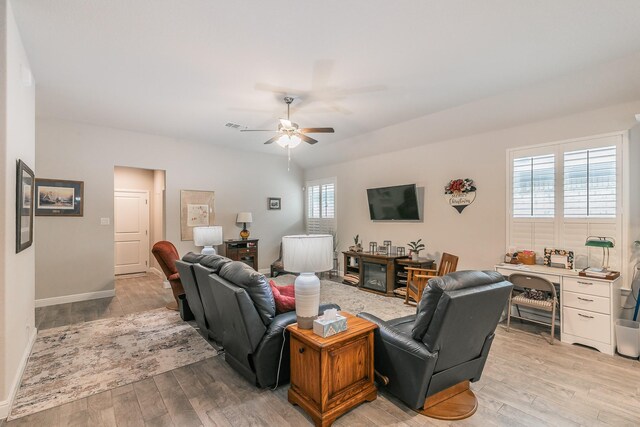 1725 Bellatrix Dr, Haslet, TX 76052 - living area featuring a ceiling fan, baseboards, light wood-style flooring, and visible vents