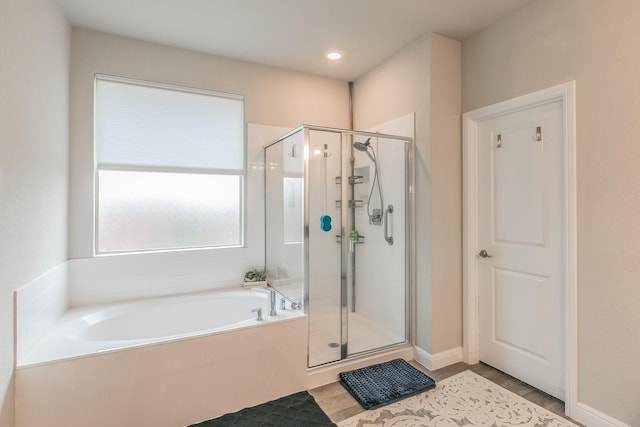 1725 Bellatrix Dr, Haslet, TX 76052 - full bath with a stall shower, a garden tub, and wood finished floors