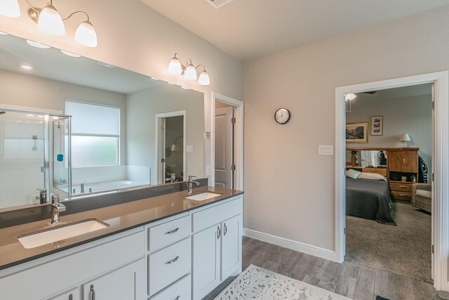 1725 Bellatrix Dr, Haslet, TX 76052 - full bathroom featuring ensuite bathroom, wood finished floors, a shower stall, and a sink