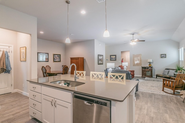 1725 Bellatrix Dr, Haslet, TX 76052 - kitchen with decorative light fixtures, dishwasher, a sink, open floor plan, and light wood-style floors