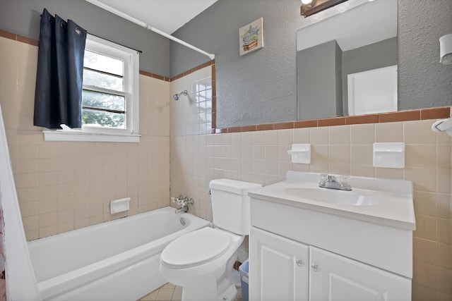 7810 Maxwell Ave, Dallas, TX 75217 - bathroom with tile walls, shower / bath combo with shower curtain, toilet, vanity, and a textured wall