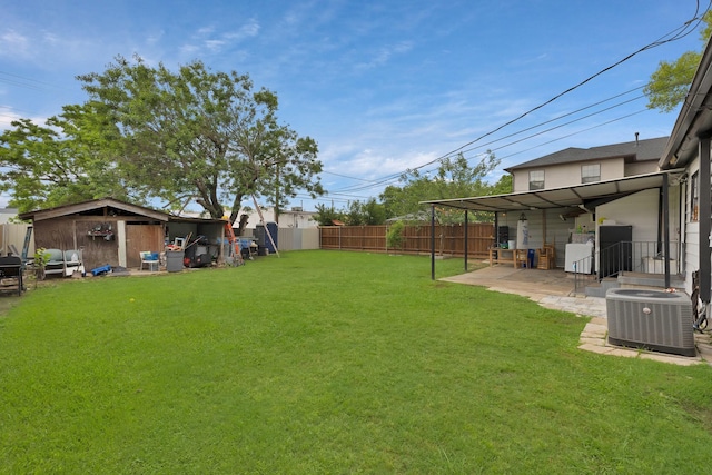 7810 Maxwell Ave, Dallas, TX 75217 - view of yard with a fenced backyard, a patio area, cooling unit, and an outbuilding