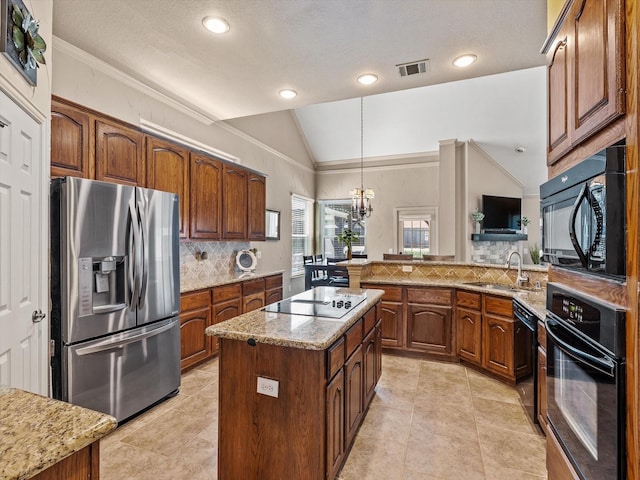 kitchen featuring lofted ceiling, visible vents, a sink, black appliances, and tasteful backsplash
