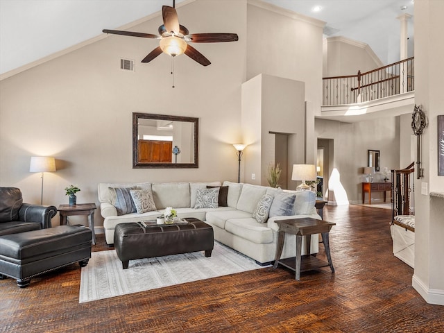 living area featuring ceiling fan, high vaulted ceiling, baseboards, and wood finished floors