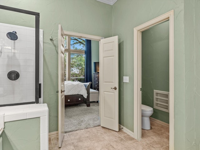 4308 Echo Bluff Dr, Plano, TX 75024 - ensuite bathroom with tiled shower, tile patterned flooring, toilet, and baseboards