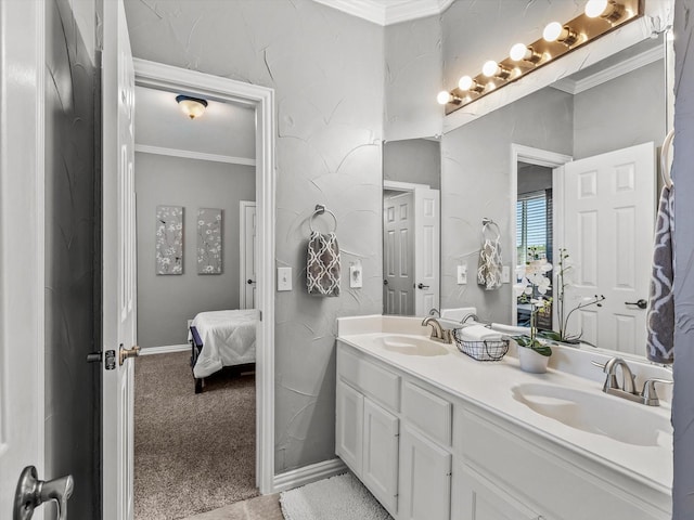 ensuite bathroom featuring ensuite bathroom, ornamental molding, double vanity, and a sink