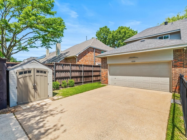 view of front of house with fence, a shingled roof, an outdoor structure, a shed, and brick siding
