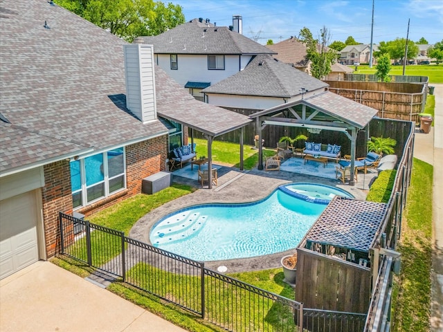 view of swimming pool featuring an outdoor hangout area, a gazebo, a patio, and a fenced backyard