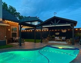 view of swimming pool with a patio, a gazebo, and an outdoor living space