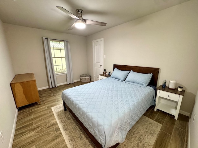 124 Oakwood St, Chico, TX 76431 - bedroom featuring baseboards, ceiling fan, and wood finished floors