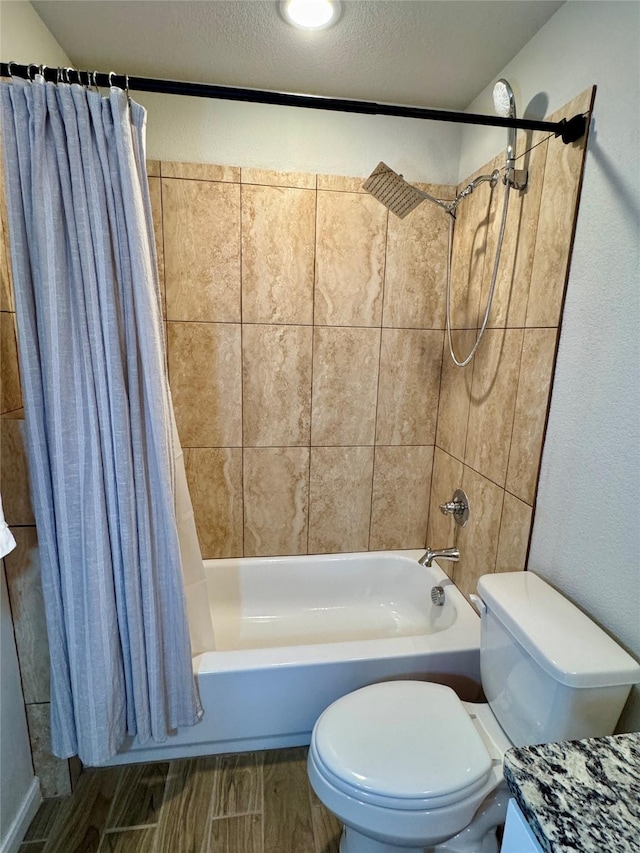 124 Oakwood St, Chico, TX 76431 - bathroom featuring wood tiled floor, shower / bathtub combination with curtain, toilet, and a textured ceiling