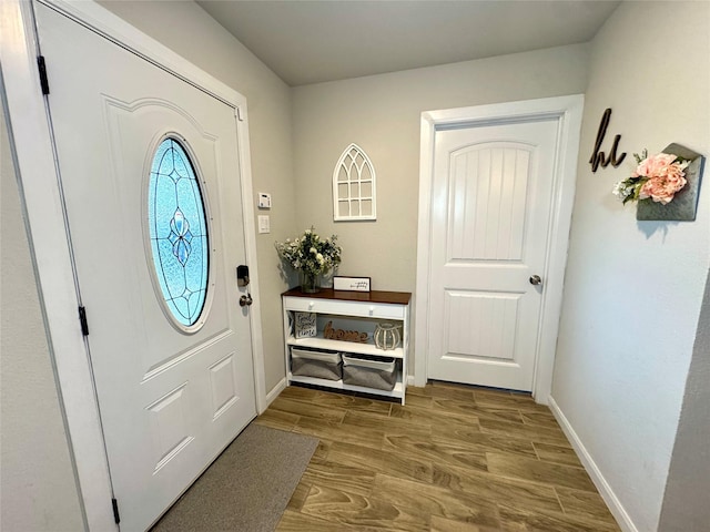124 Oakwood St, Chico, TX 76431 - entryway featuring baseboards and wood finished floors