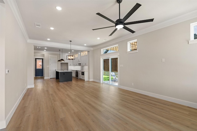 unfurnished living room featuring baseboards, recessed lighting, visible vents, and crown molding