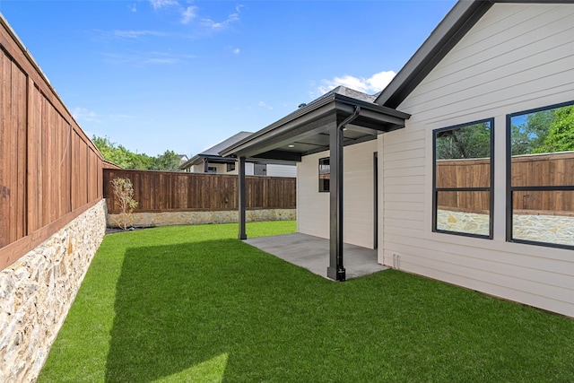 view of yard featuring a patio and a fenced backyard